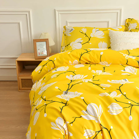 Modern yellow floral bedding set styled in bright bedroom with colorful sheets